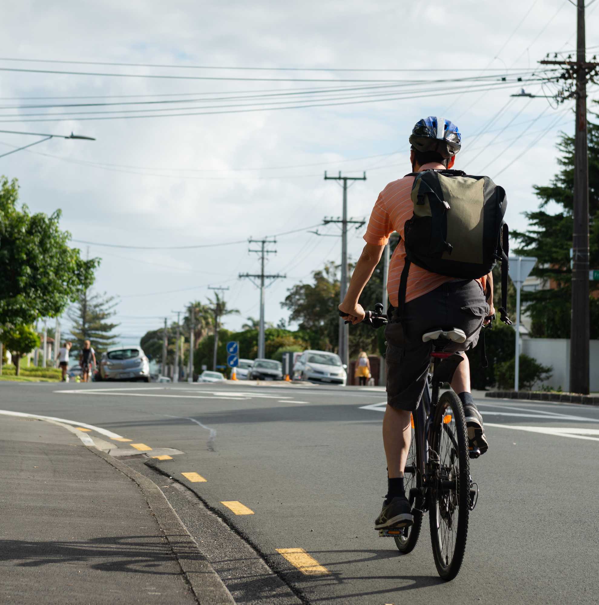 Cyclist going down street Cyclist going down street