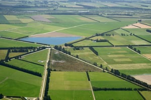 Aerial of complex intersection amid cropping farms in Canterbury, South Island