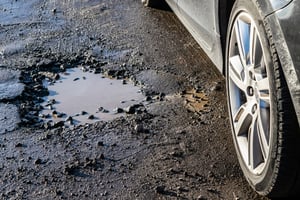 pothole by car